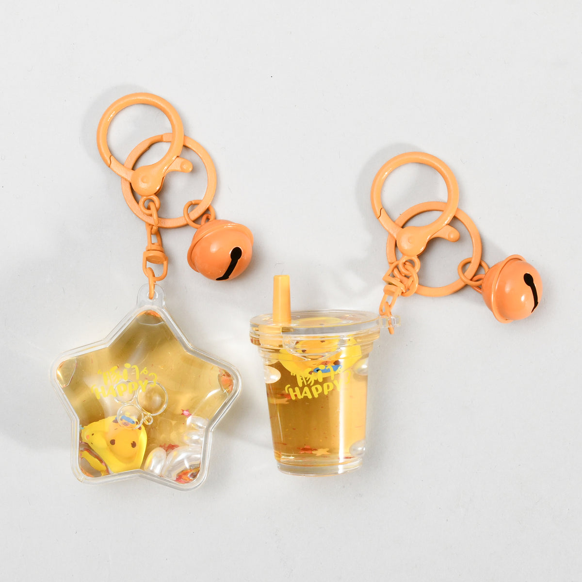 Unsinkable Capybara Transparent Keychain with Decorative Bell - Milk Tea Cup / Star