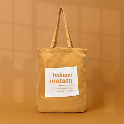 Mumuso &quot;Hakuna Matata&quot; Tote Bag - Dark Amber