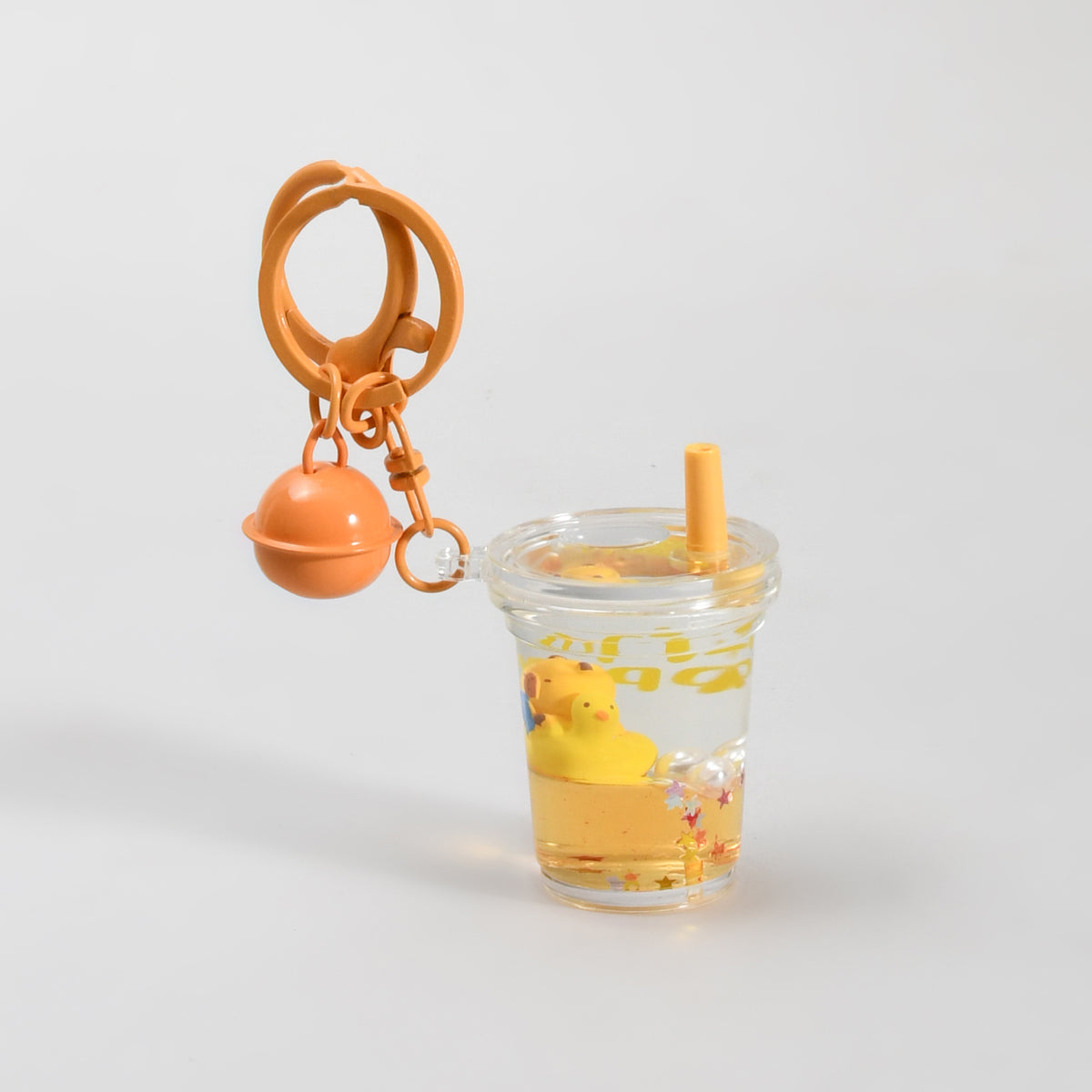 Unsinkable Capybara Transparent Keychain with Decorative Bell - Milk Tea Cup / Star